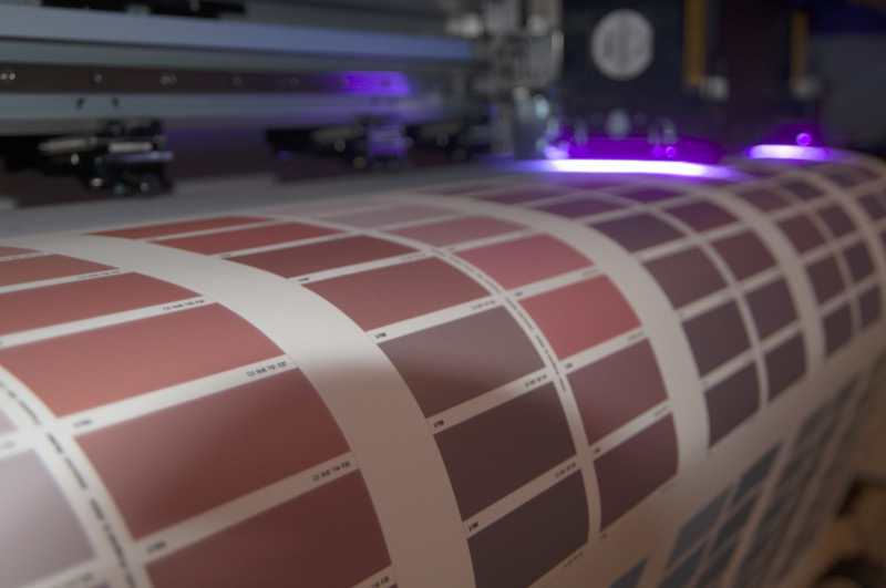 A freshly printed wallpaper roll coming off the large-format press