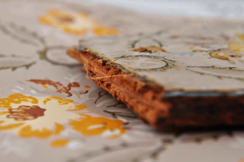 A physical wallpaper fragment removed from a wall