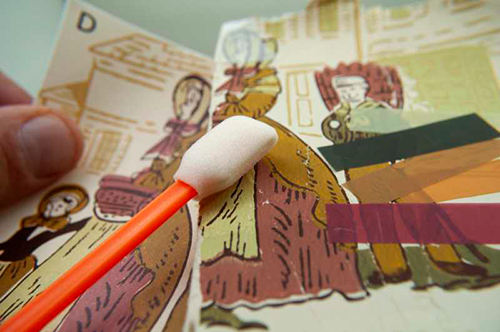 Vintage wallpaper sample being reprinted and tested for both quality and color