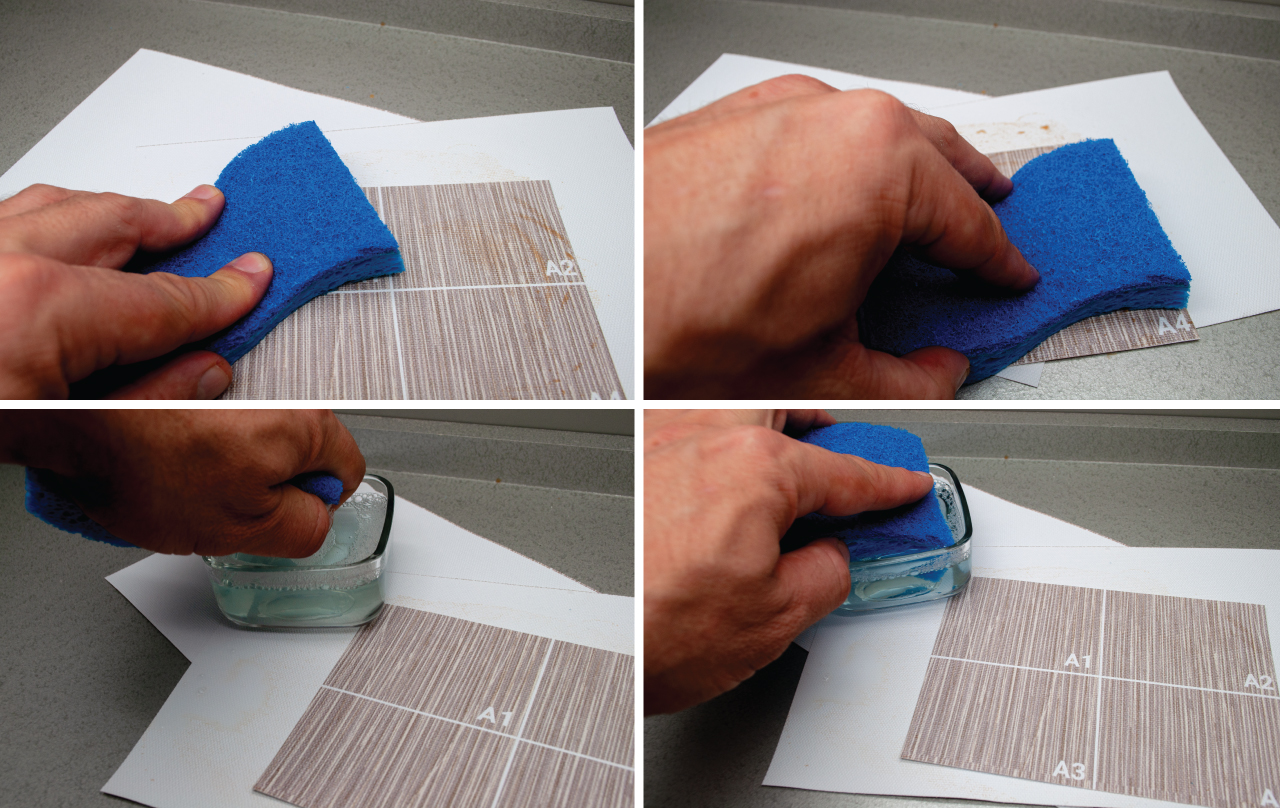 Image of hand and sponge cleaning wallpaper