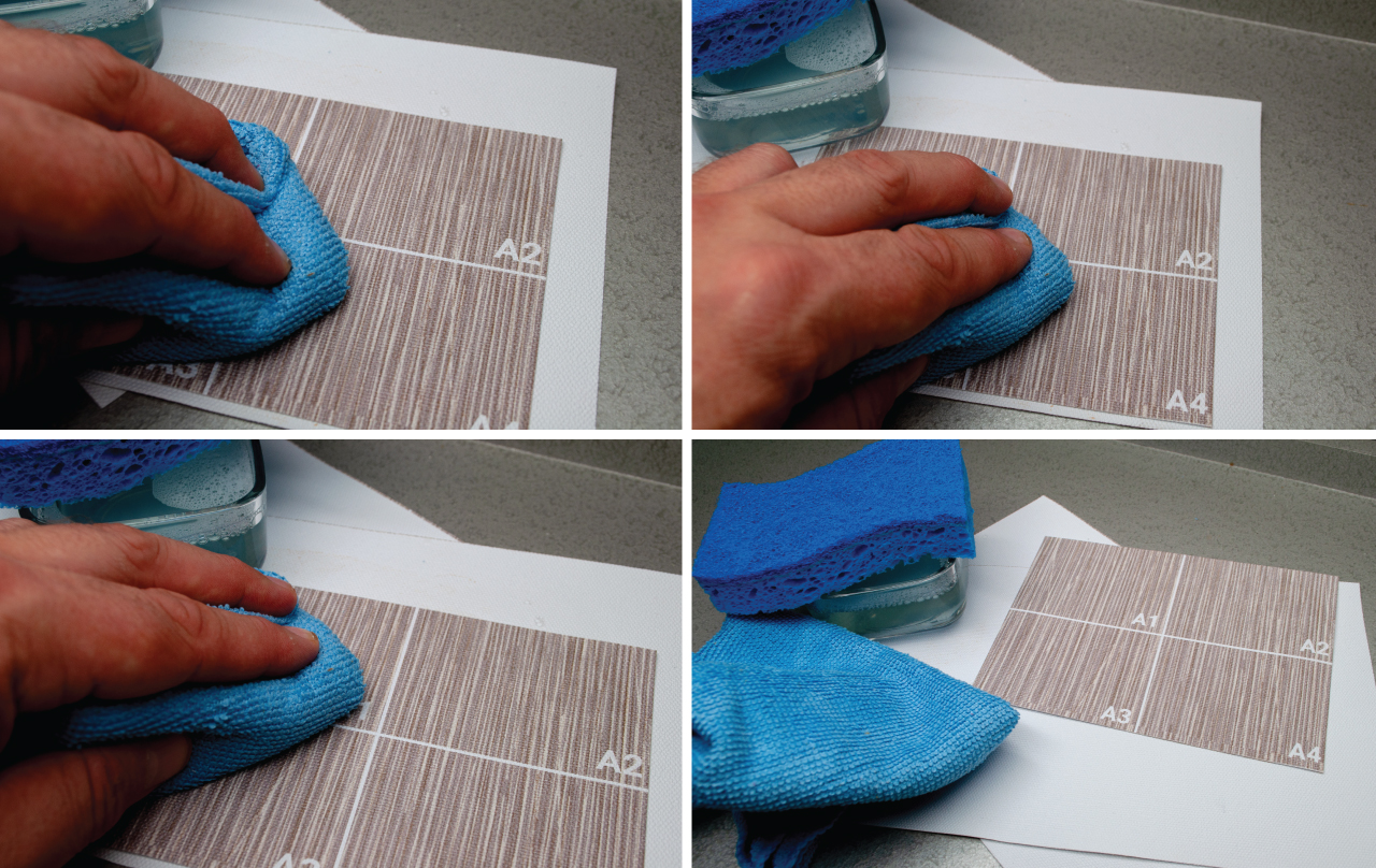 Image of hand and rag cleaning wallpaper