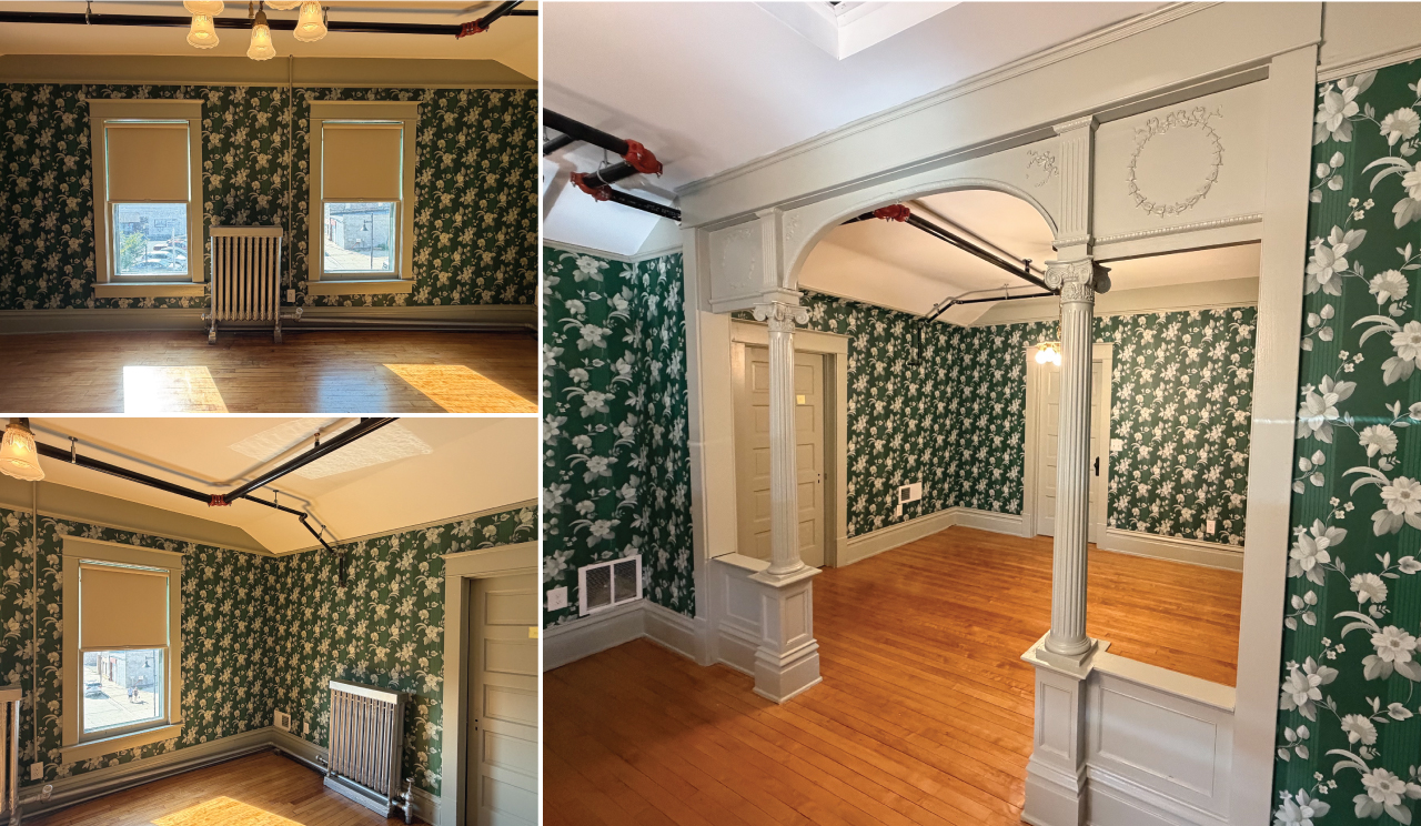 Photograph of the completed installation of the green floral wallpaper in the bedroom interior