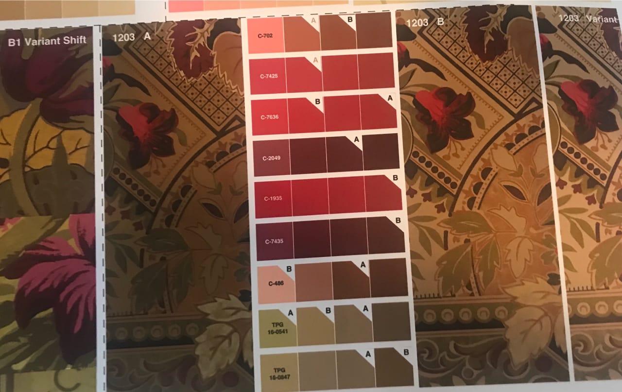 Recreated Glenmore Mansion wallpaper motif being matched against graded color-chip proofs during historic color calibration