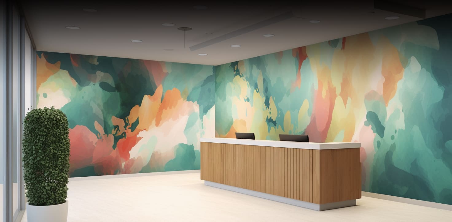 A hotel lobby with a large painterly mural behind the reception desk
